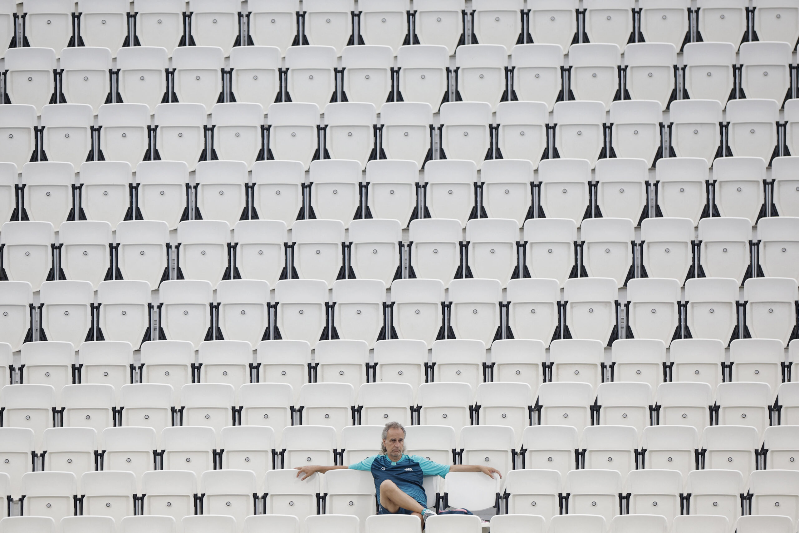 A member of staff was seen sitting in the empty stands