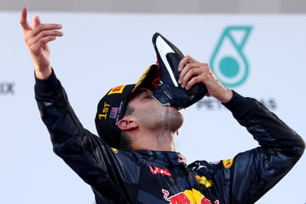 Ricciardo does a shoey in Kuala Lumpur in 2016.