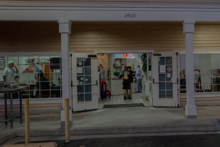 teens  hug in restaurant doorway