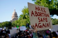 Demonstrators march and gather near the Texas Capitol following the U.S. Supreme Court's...