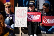 Jozette Leal, left, holds a placard as the 20-year-veteran of toiling at Safeway joins...