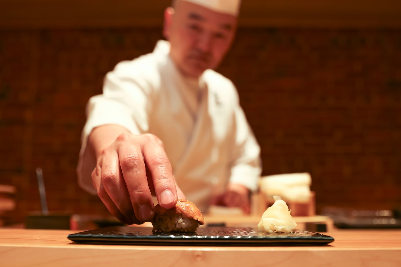 Chef Tatsuya Sekiguchi prepares Uni sea urchin, on Saturday, Sept. 14, 2024, at Tatsu Dallas.