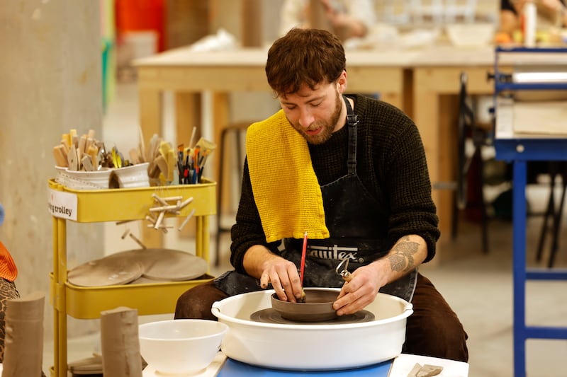 A potter works at his wheel in Throwing Shapes community ceramics studio on Mill Street, Dublin 8. Photograph: Alan Betson 