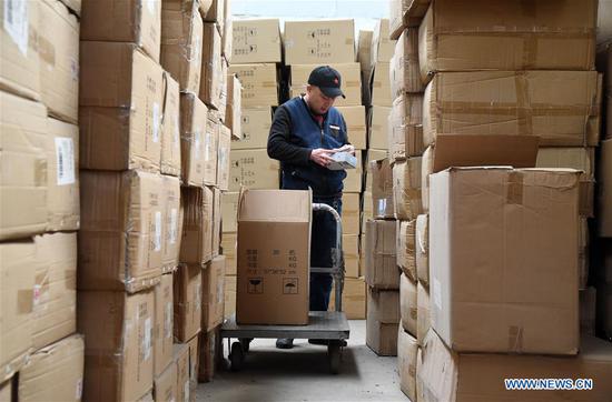 A staff member works at a warehouse in a company in Pengcheng Town of Handan, north China's Hebei Province, Nov. 4, 2020. Companies started to prepare for the upcoming Singles Day sale, an online shopping festival. (Photo by Hao Qunying/Xinhua)