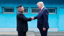 North Korean leader Kim Jong Un and U.S. then-President Donald Trump shake hands over the military demarcation line between North and South Korea on June 30, 2019.