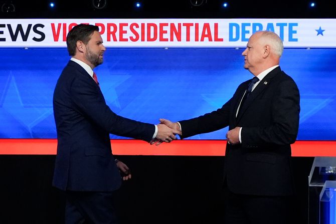 Vance and Walz shake hands before the start of the debate.