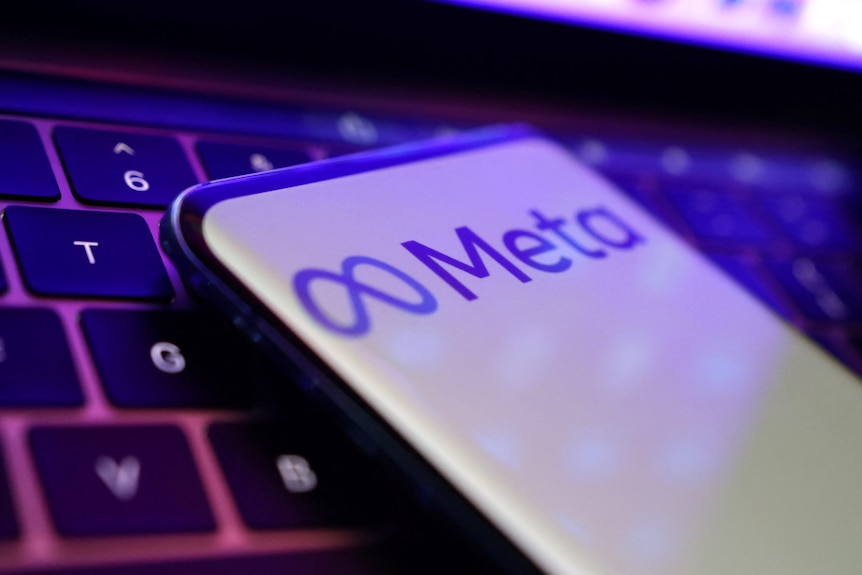 The symbol for meta is sitting on top of a computer keyboard.