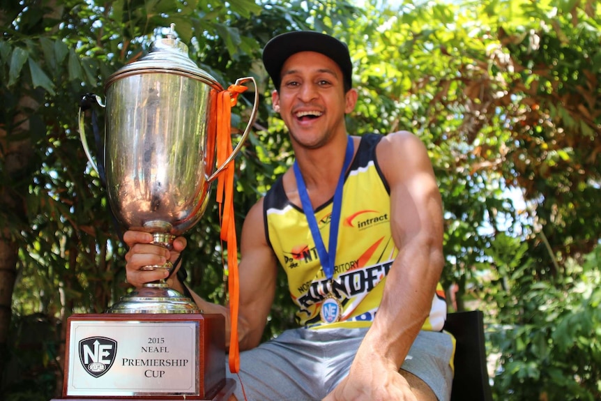 NT Thunder captain Aaron Motlop reunited with Premiership trophy