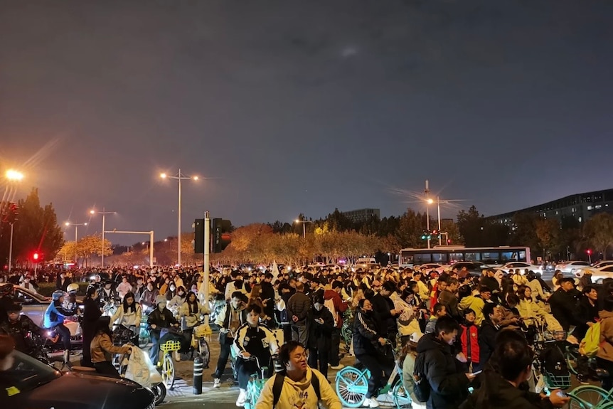 students on bikes at night