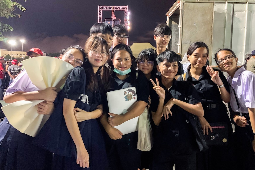 A group of young people stand together for a photo