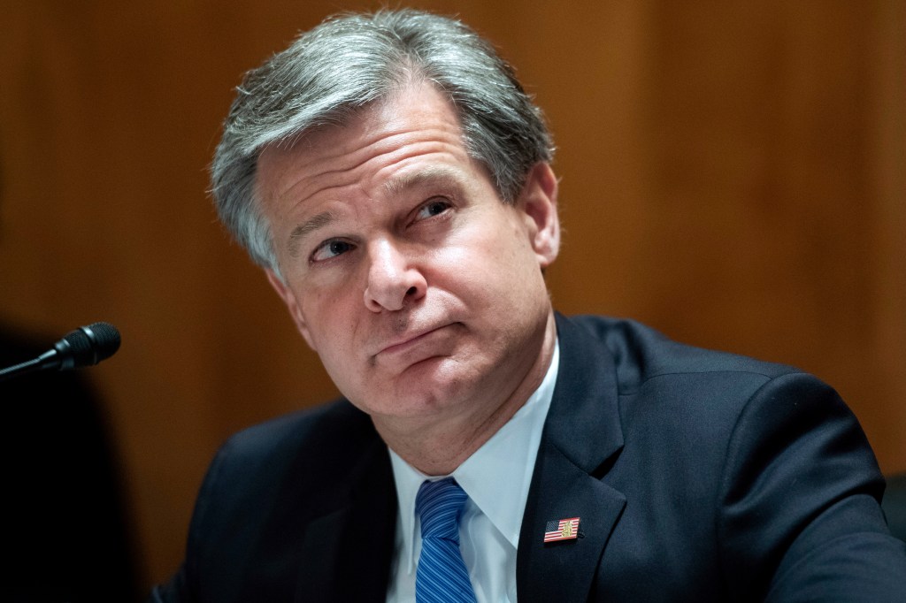 FBI Director Christopher Wray testifying on Capitol Hill in Washington, September 2020, facing future job uncertainty