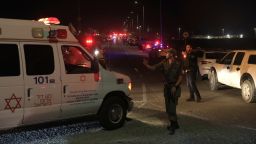 Emergency services personnel attend the scene of a drone strike on October 13, 2024 in Binyamina, Israel. Initial reports suggest at least 40 people were injured near Binyamina, Israel, following a drone strike launched by Hezbollah.