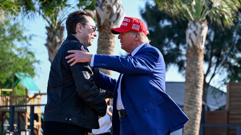 President-elect Donald Trump greets Elon Musk before the launch of the sixth test flight of the SpaceX Starship rocket Tuesday, Nov. 19, 2024 in Boca Chica, Texas. (Brandon Bell/Pool via AP)