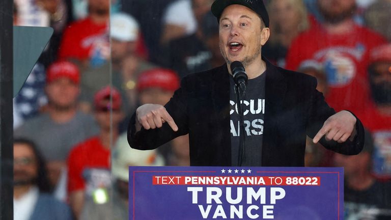 Elon Musk speaking at an event which was the site of the July assassination attempt against Trump. Pic: Carlos Barria/Reuters