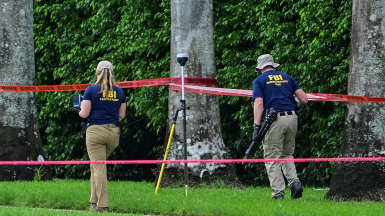 Members of the FBI investigate the area around Trump International Golf Club, after an apparent assassination attempt on Republican presidential nominee and former U.S. President Donald Trump, after a gunman was found at the Trump's golf course, in West Palm Beach, Florida, U.S. September 16, 2024. REUTERS/Giorgio Viera