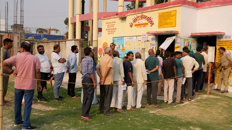 People stand in a queue to cast their votes during the fifth round of multi-phase national elections outside a polling station in Ayodhya, India, Monday, May 20, 2024. (AP Photo/Rajesh Kumar Singh)