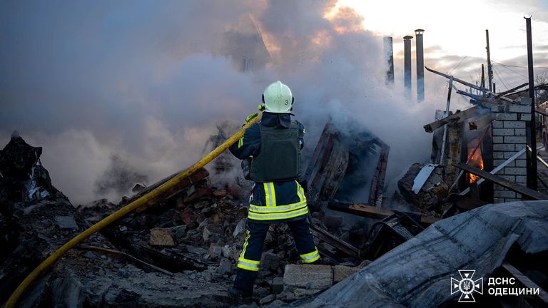 A firefighter at the site of a Russian missile strike in Odesa. Pic: State Emergency Service of Ukraine/Reuters